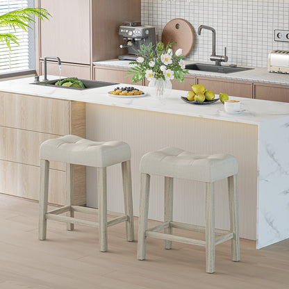 Set of 2 upholstered light gray counter height bar stools with curved saddle seats from Wilsons Home Store.