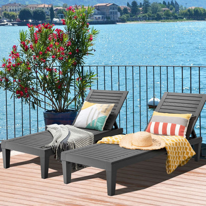 Set of 2 black outdoor chaise lounge chairs with 5-position adjustable backrests, perfect for patio relaxation.
