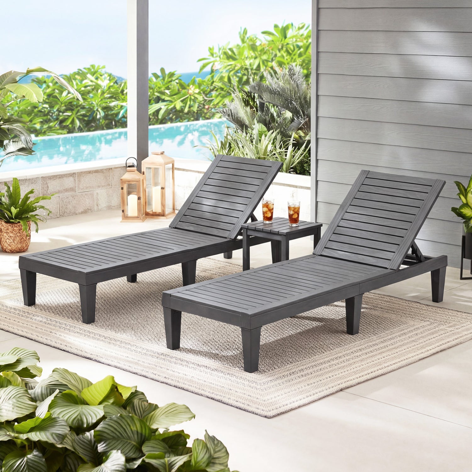 Set of 2 black outdoor chaise lounge chairs with adjustable backrests, ideal for patio relaxation and outdoor seating.