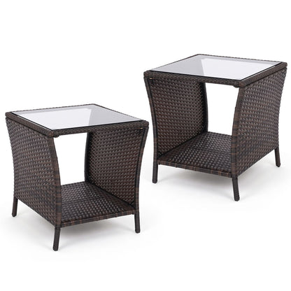 Set of 2 outdoor wicker side tables with tempered glass tops and storage shelves, perfect for patio or outdoor spaces.