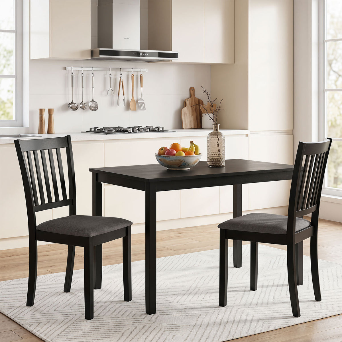 Set of 2 black wooden dining chairs with upholstered seats and rubber wood frames for kitchen and dining room use.
