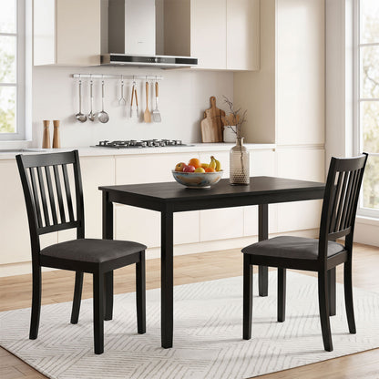 Set of 2 black wooden dining chairs with upholstered seats and rubber wood frames for kitchen and dining room use.