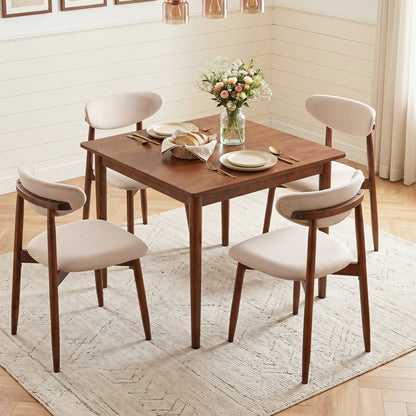 Set of 4 beige fabric upholstered dining chairs with curved backs, modern kitchen and dining furniture by Wilsons Home Store