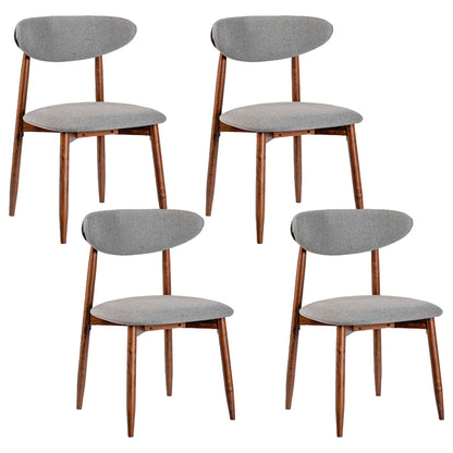 Set of four beige fabric upholstered dining chairs with curved backs, designed for kitchen and dining room use.