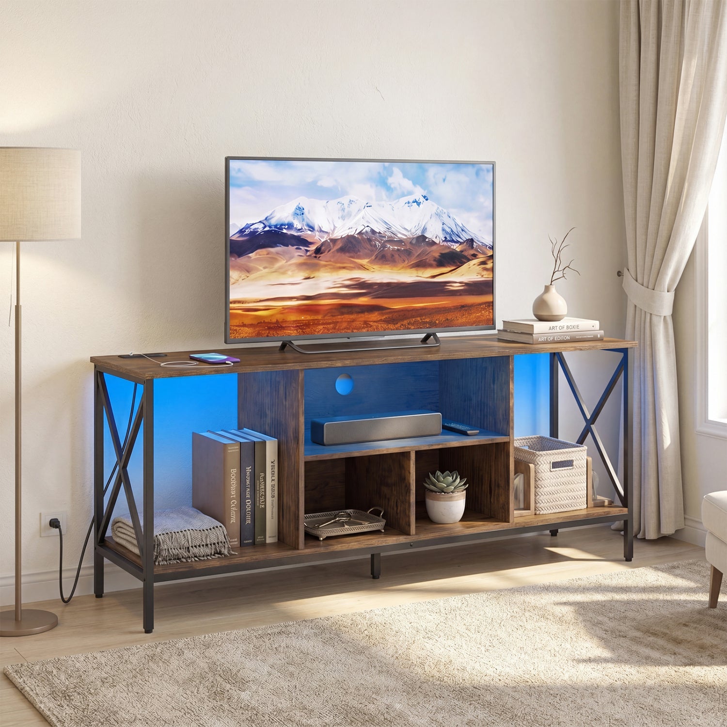 Black TV stand with LED lights for 65-inch TVs, featuring power outlets, modern entertainment center from Wilsons Home Store
