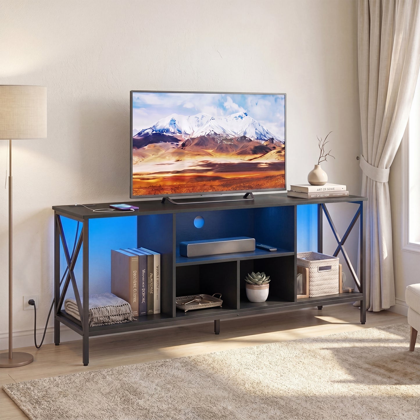 Black TV stand with LED lights for 65-inch TVs, featuring power outlets and modern entertainment center design.