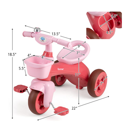 Green toddler tricycle with limited steering, front baskets, and bell, designed for push and pedal riding for young children.