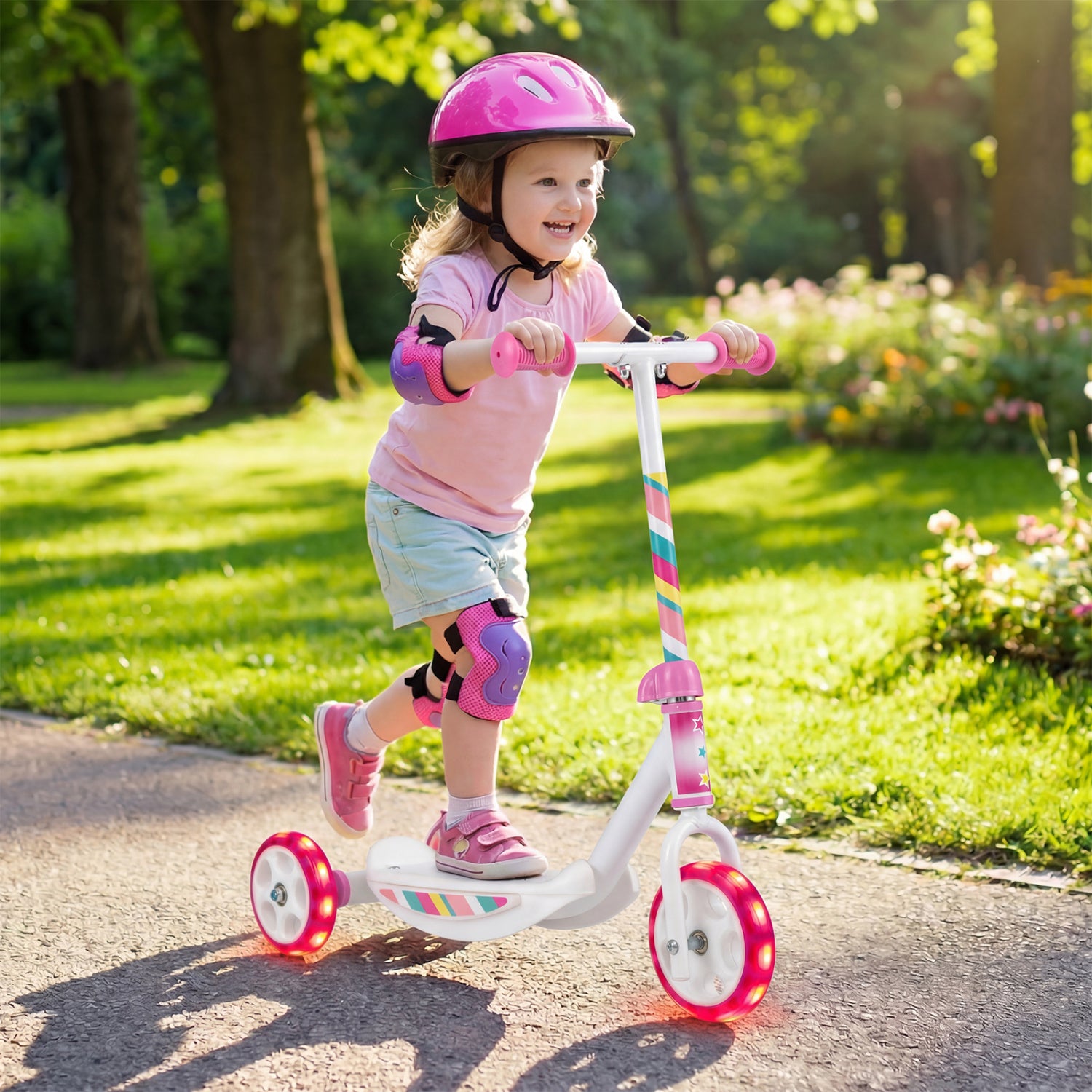 Pink toddlers' kick scooter with LED light-up wheels, wide anti-slip deck, suitable for boys and girls, by Wilsons Home Store.