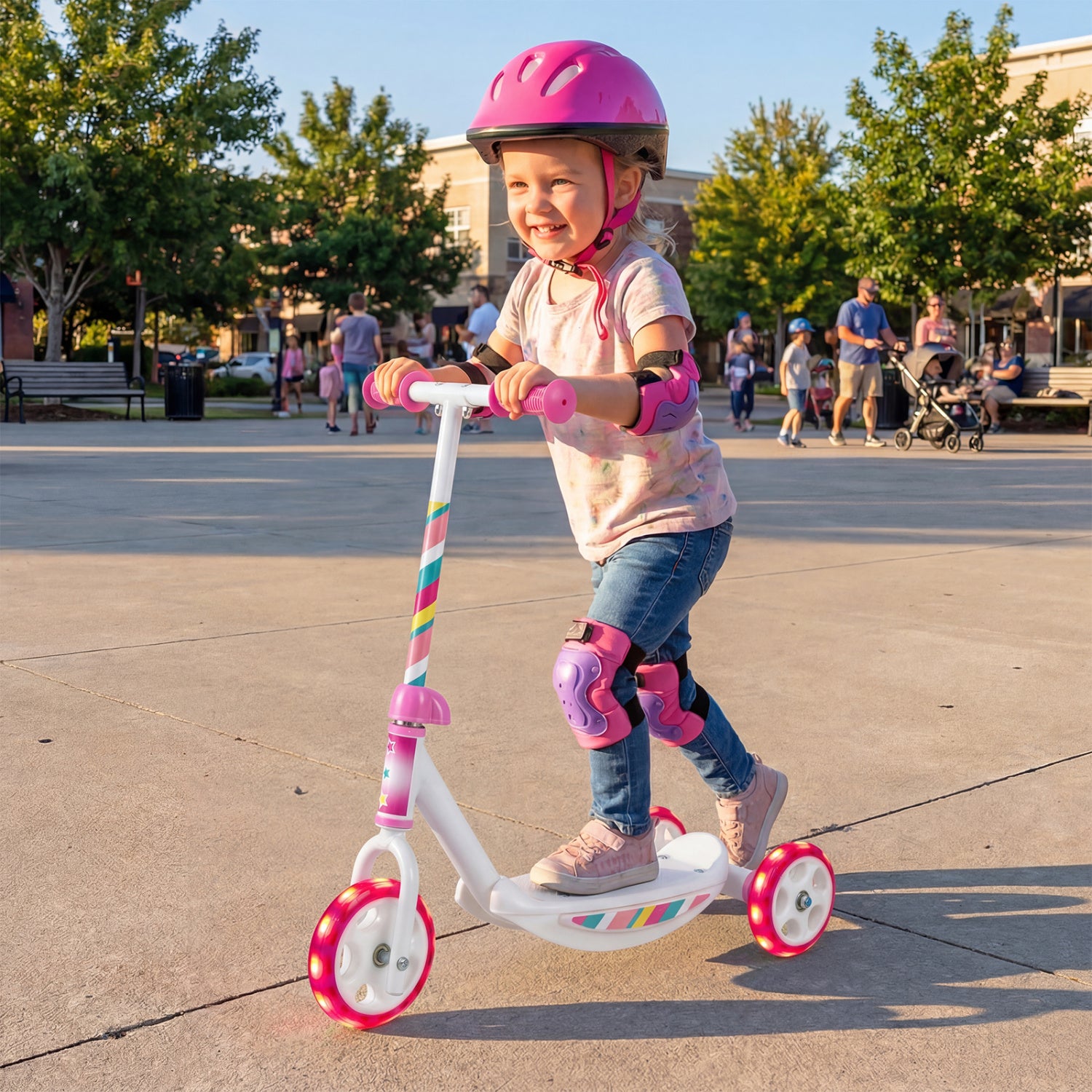 Pink toddlers' kick scooter with LED light-up wheels, wide anti-slip deck, suitable for boys and girls, from Direct by Wilsons Home Store.