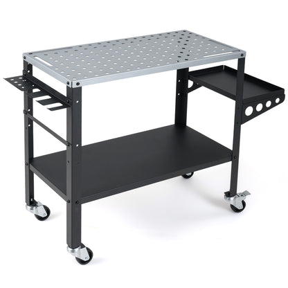 Welding table 36x18 inches with lockable wheels, 144 fixture holes, and tool slots, suitable for outdoor garage workspace.