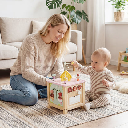 Wooden activity cube with Montessori sensory toys for toddlers 18+ months, featuring colorful blocks and interactive elements.