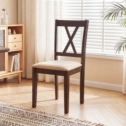 Set of four walnut wooden dining chairs with fabric upholstery, ideal for kitchen and dining room furniture.