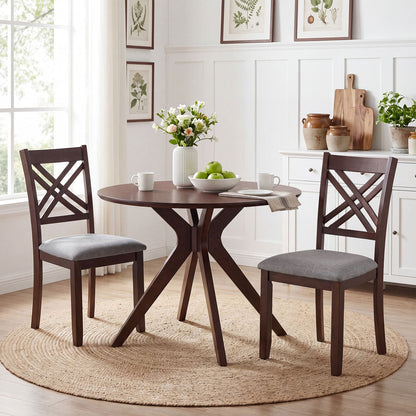 Set of two brown wooden dining chairs with fabric-padded seats and solid rubber wood construction for kitchen dining.