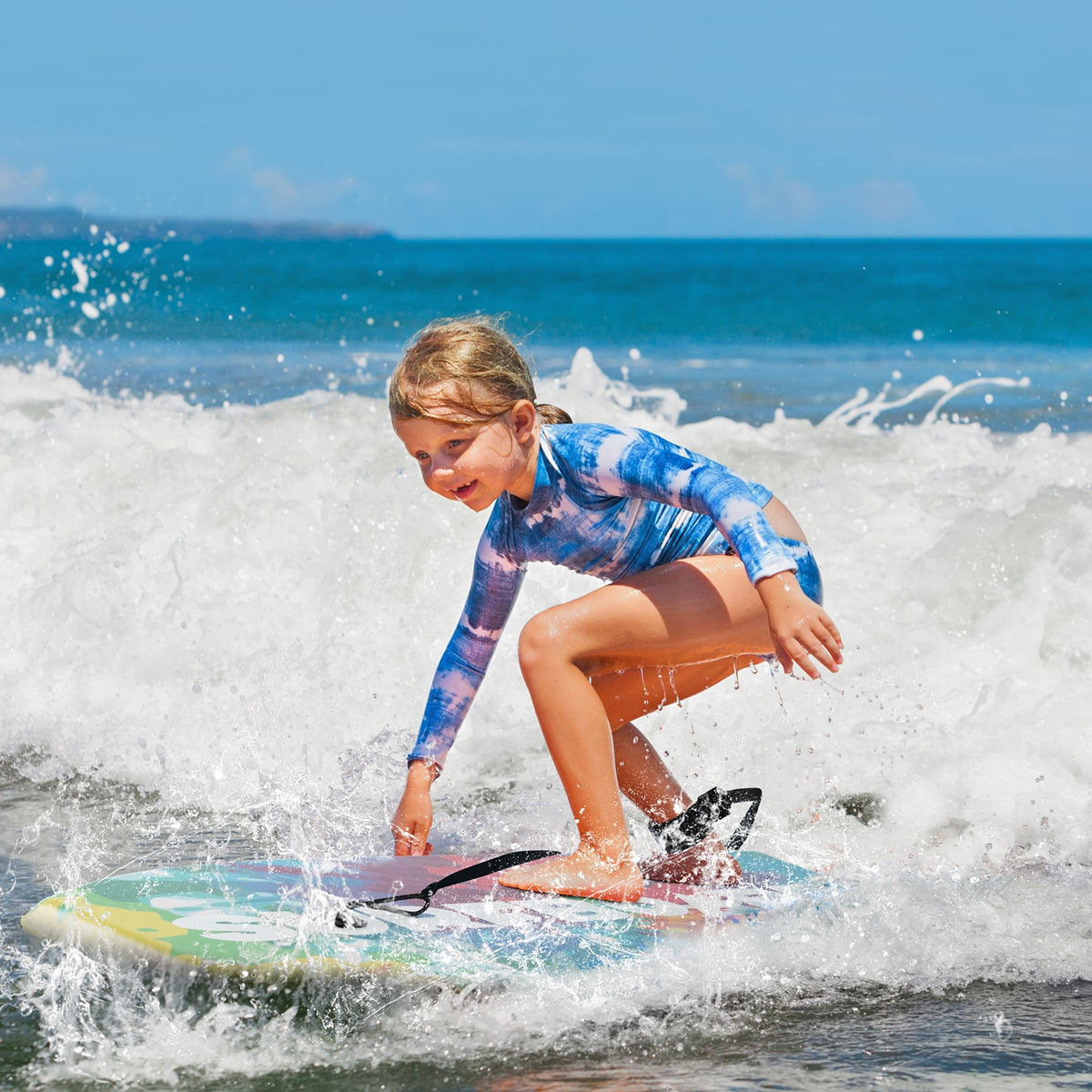Lightweight multicolor bodyboard with EPS core, XPE deck, and HDPE bottom, designed for water sports and surfing.