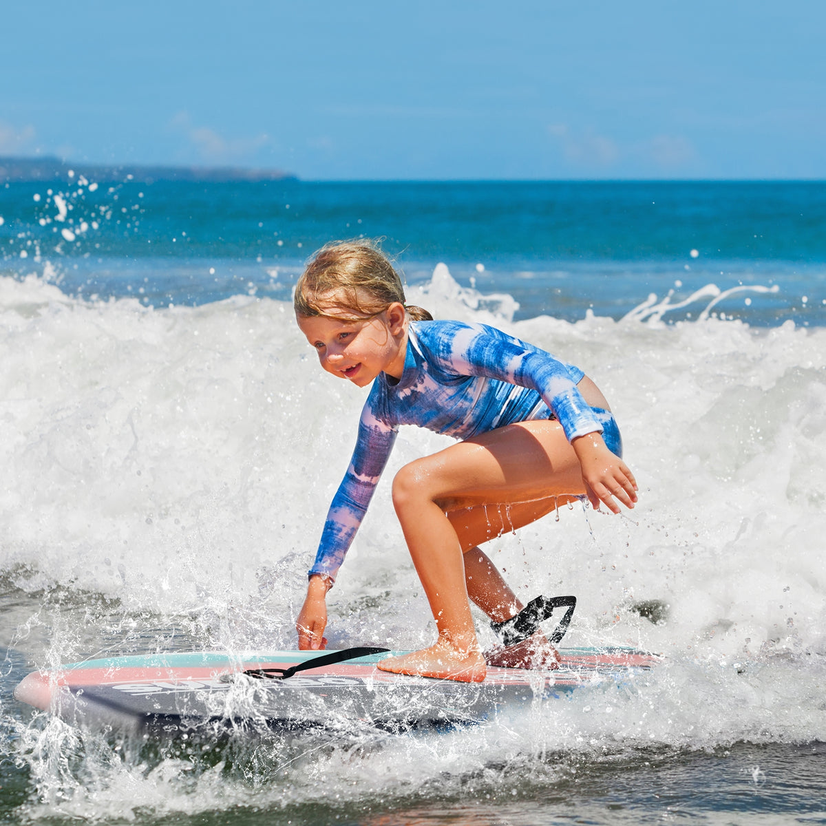 Lightweight multicolor body board with EPS core and HDPE bottom, ideal for surfing and water sports, by Direct by Wilsons Home Store.