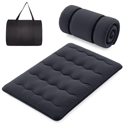 Full-size Wilsons Home Store futon mattress with washable cover and foldable design, shown on a bedroom floor.