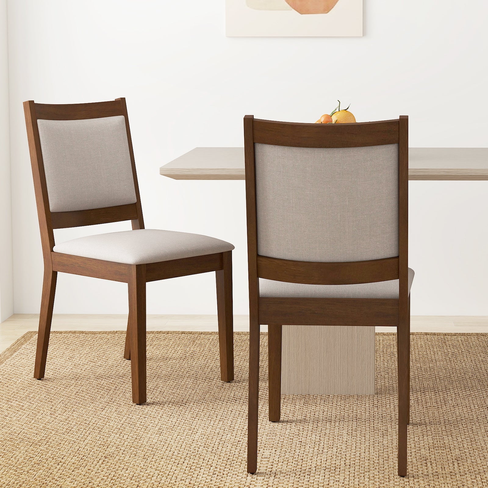 Set of two brown modern upholstered kitchen dining chairs with padded backrests, ideal for stylish and comfortable dining spaces.