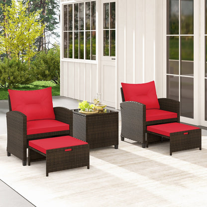 Beige 5-piece patio rattan furniture set with 2 ottomans and a tempered glass coffee table for outdoor patio seating.