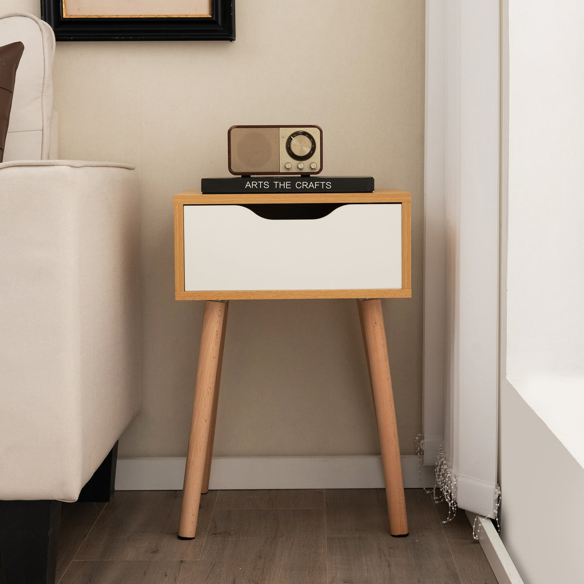 Modern bedroom nightstand with storage drawer, featuring a sleek design and wooden finish, suitable for bedroom or living room use.