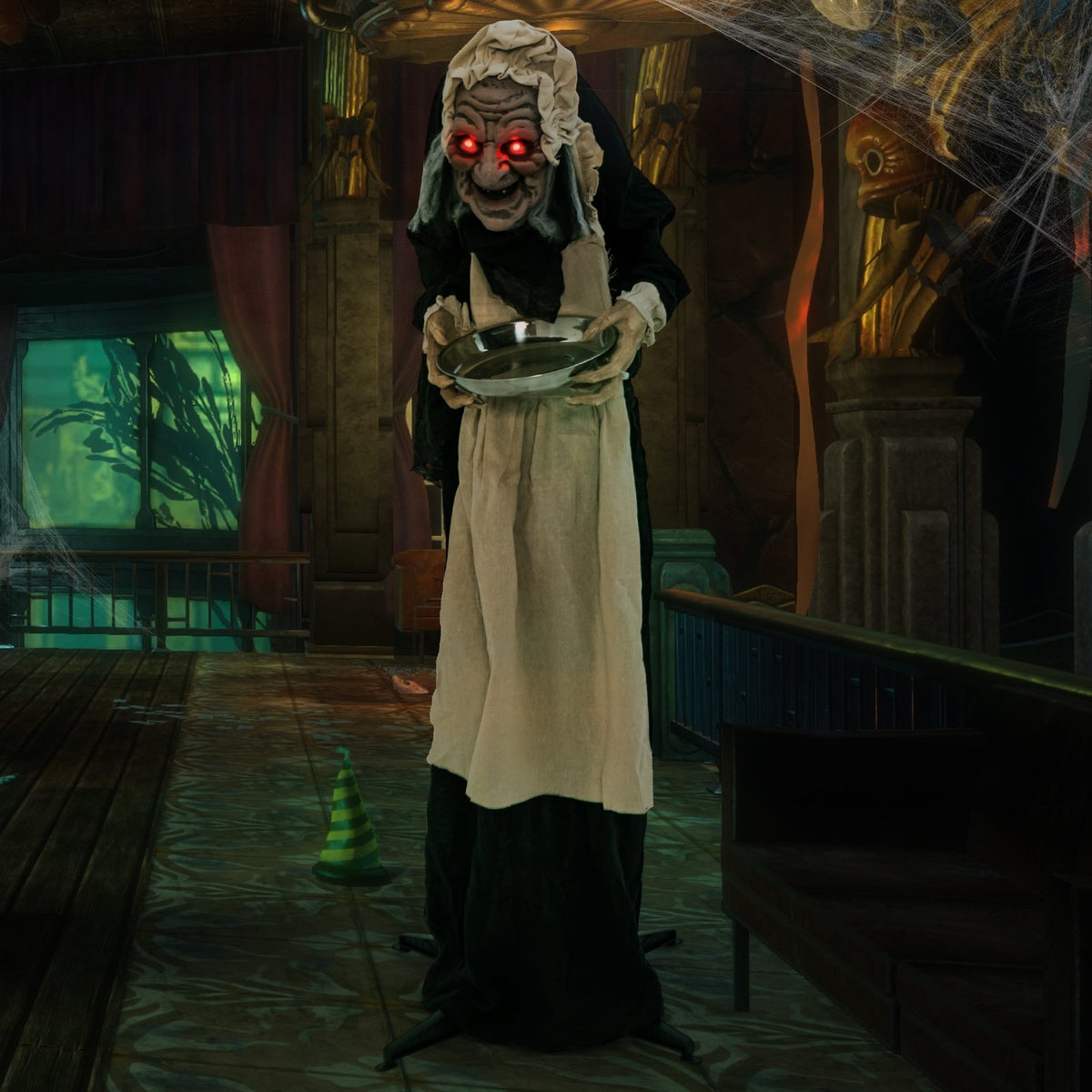 Animated 5.2-foot Halloween greeter statue of an old lady holding a candy dish, perfect for holiday decor.