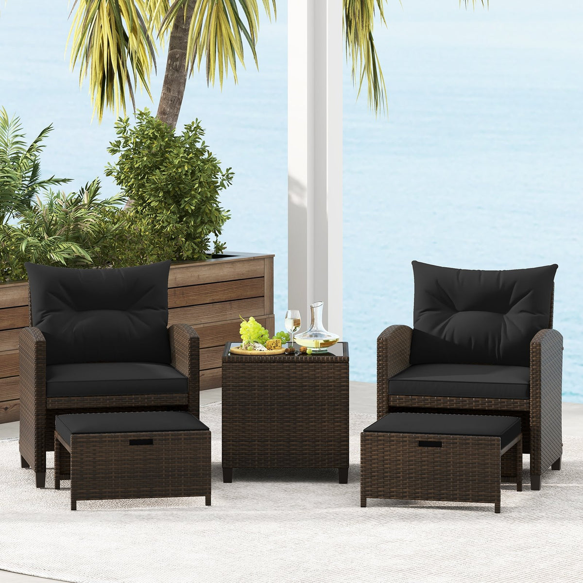 Beige 5-piece patio rattan furniture set with two ottomans and glass coffee table for outdoor patio relaxation.