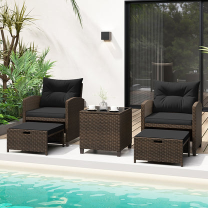 Beige 5-piece outdoor patio rattan furniture set with 2 ottomans and glass coffee table for outdoor living space.